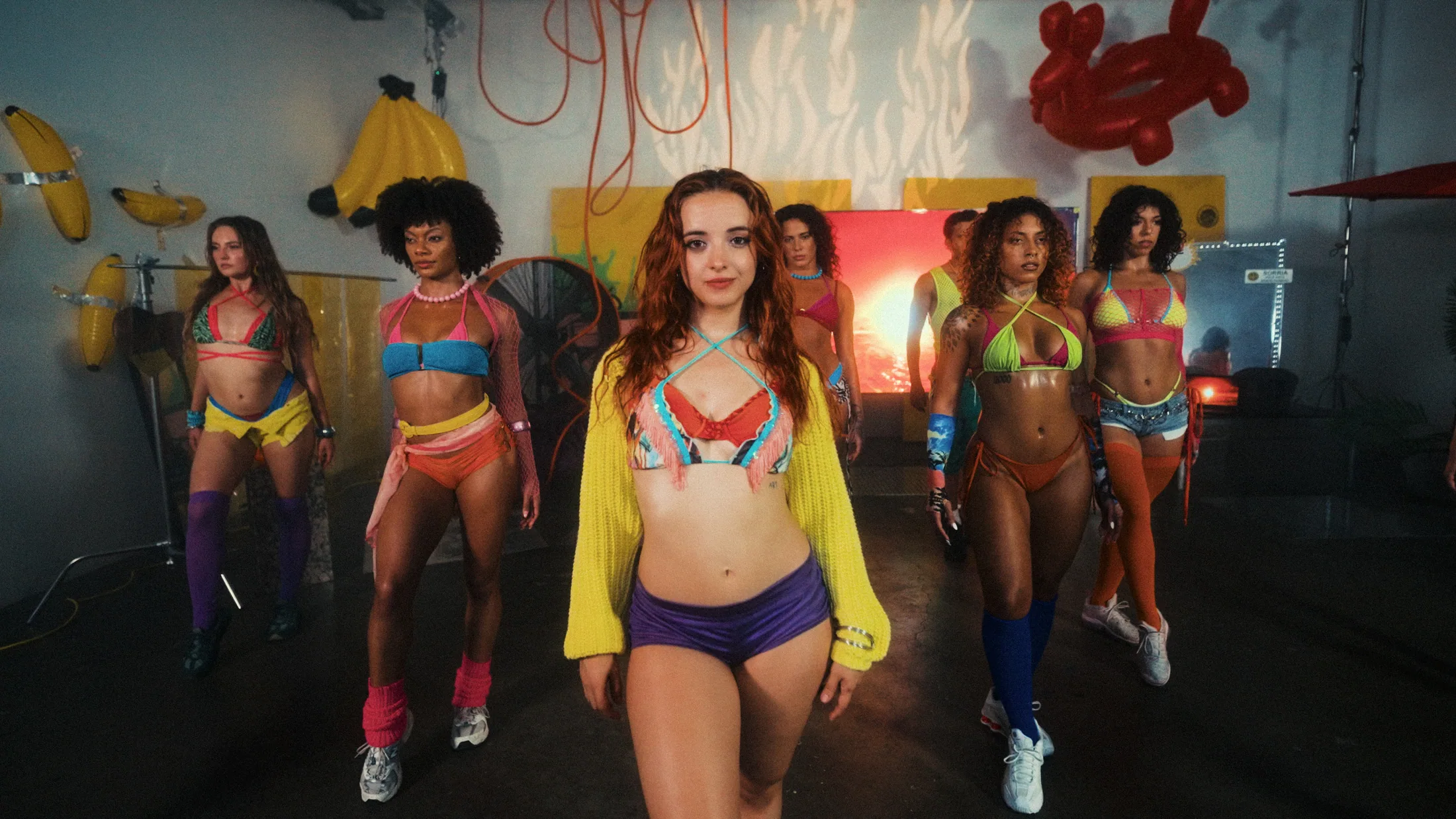 Dancers advancing through the garage in summer clothing